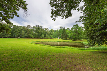 A park with a pond and a bench