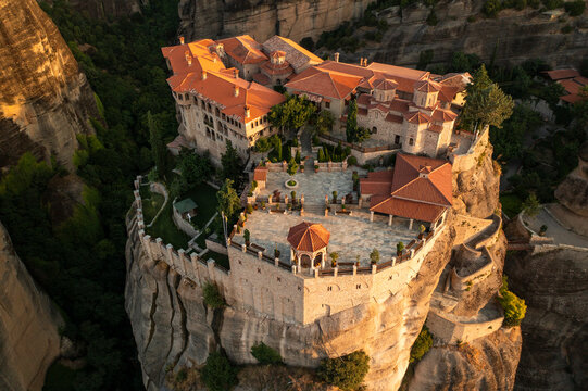 Aerial view of beautiful monasteries perched on ancient rock formations amidst scenic mountains, Kastraki, Greece.