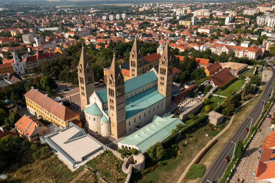 Aerial view of historic cityscape with vibrant rooftops and spires, Pecs, Baranya County, Hungary.