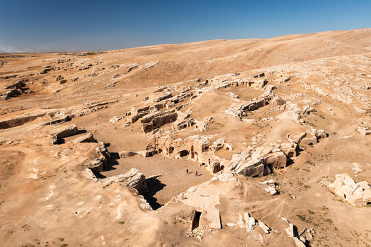 Aerial view of ancient ruins in a vast arid landscape, Dara, Mardin, Turkiye.