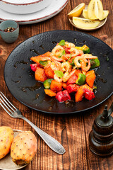 Salad with prawns and fruit.
