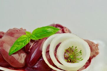 fresh chicken liver close-up on white background