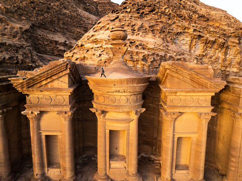 Aerial view of ancient sandstone structures and rock formations of Petra, Ma'an, Jordan.