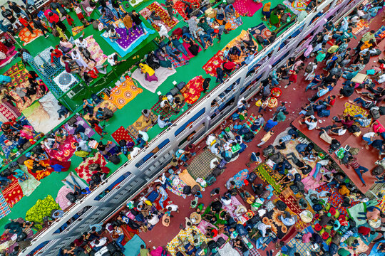 Aerial view of colourful ferries crowded with muslims returning home for eid on the buriganga river, Keraniganj, Bangladesh.
