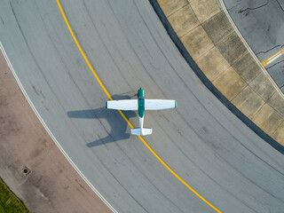 Aerial view of Aeropuerto de Carrasco with airplane on runway and concrete patterns, Canelones, Uruguay.