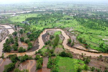 Aerial view of An aerial view of farming land immersed in water flood rocked in Raigad, Maharashtra, India On July 26th 2005