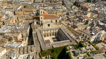 Fototapeta premium Aerial view of the church of Santa Irene in the historic center of Lecce, Puglia, Italy. It is one of the main places of worship in the city and has a large courtyard.
