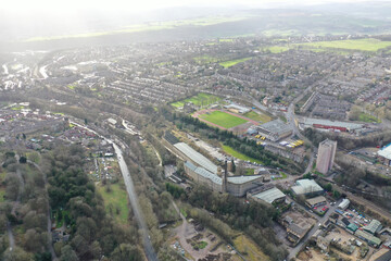 Aerial drone photo of the town centre of the town of Halifax in West Yorkshire showing the old historic building on a foggy day in the winter time
