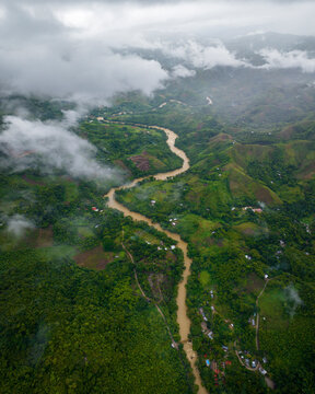 Aerial view of picturesque Semuc Champey waterfall surrounded by lush rainforest and winding Cahabon river, Alta Verapaz, Guatemala.