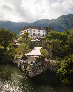 Aerial view of Isole di Brissago with elegant villa surrounded by tranquil water and lush greenery, Brissago, Switzerland.