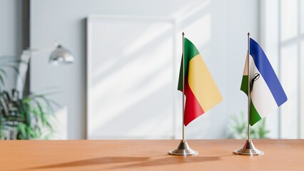 FLAGS OF BENIN AND LESOTHO ON TABLE