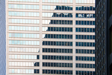 Abstract skyscraper reflection on building exterior, Toronto, Canada