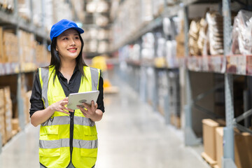 Female engineer is handling shipping and checking stock inventory in the warehouse with a tablet, industry, import-export, inventory management, logistics, global transportation at warehouse, business