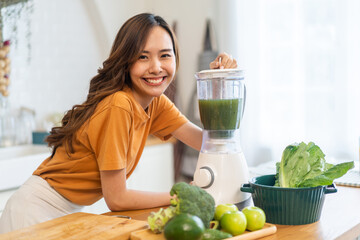 Portrait of beauty healthy asian woman making green vegetables detox cleanse and green fruit...