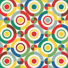 Fototapeta premium Vector illustrator of a dynamic pattern using circles in primary colors arranged in a grid.