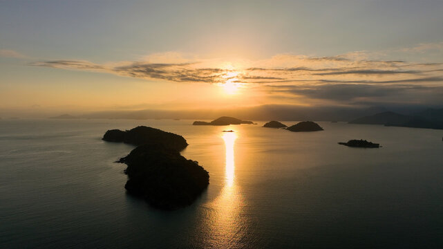 Aerial view of beautiful islands and serene ocean at sunset, Paraty, Brazil.
