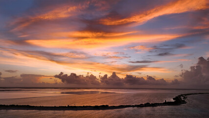 Aerial view of a tranquil sunset over the vibrant ocean and unspoiled reef, Bonaire, Caribbean Netherlands.