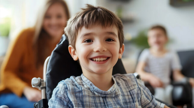 Smiling boy with SP in a wheelchair in the room. World Cerebral Palsy (SP) Day. Disabled child at home with family. The concept of treatment, education and inclusion of sick children into society