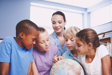 World map, woman and kids in classroom, globe and conversation with knowledge, intelligent and talking. Geography, teacher and students in school, children or studying with help, answer and learning