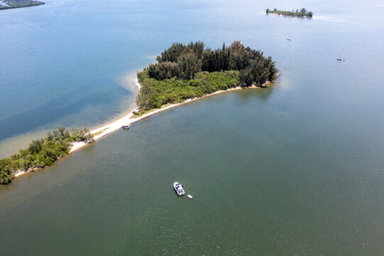 Aerial view of serene Roberts Island in Indian River Lagoon with tranquil water and lush greenery, Grant Valkaria, United States.