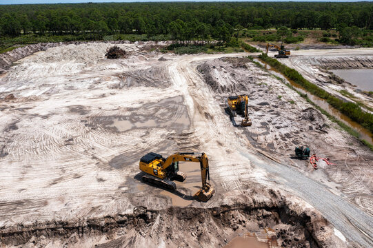 Aerial view of construction site with excavators and heavy machinery in progress, Fellsmere, United States.