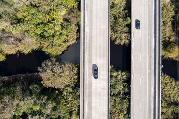 Aerial view of the north prong of the St. Sebastian River with a serene bridge and lush greenery, Sebastian, Florida, United States.