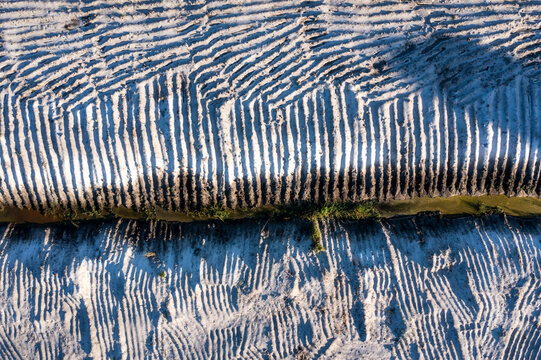 Aerial view of textured sandy landscape with unique grooves and patterns, Palm Bay, United States.