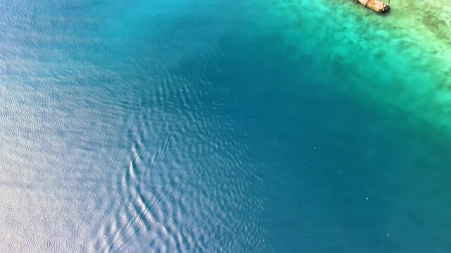 Scenic Pier with Vibrant Emerald-Colored Seaside Waters