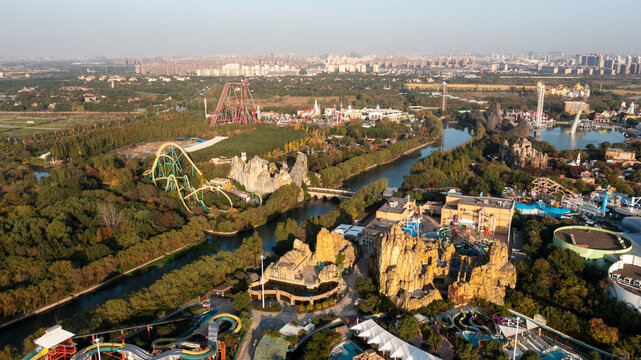 Aerial view of Songjiang Sheshan Hill amusement park with roller coasters and scenic river, Songjiang District, People's Republic of China.