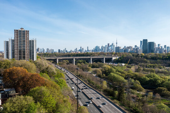 Aerial view of beautiful cityscape with highrise buildings, highway, and greenery, Toronto East End, Canada.