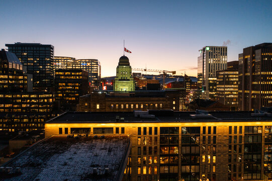 Aerial view of vibrant downtown Halifax cityscape with modern skyscrapers and city lights at twilight, Halifax City, Canada.