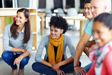 Creative, workshop and business people on floor in office for happy collaboration, planning and solidarity. Team building, men and women at design agency for employee engagement for workflow synergy
