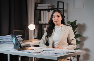 Focused Asian Businesswoman Working Late