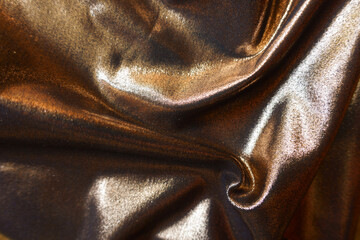 bronze nylon and spandex lame fabric in soft folds