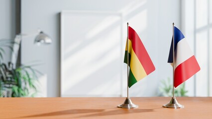 FLAGS OF BOLIVIA AND FRANCE ON TABLE