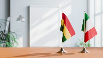 FLAGS OF BOLIVIA AND ITALY ON TABLE