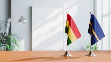 FLAGS OF BOLIVIA AND NAURU ON TABLE