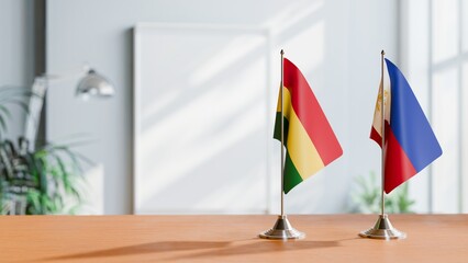 FLAGS OF BOLIVIA AND PHILIPPINES ON TABLE