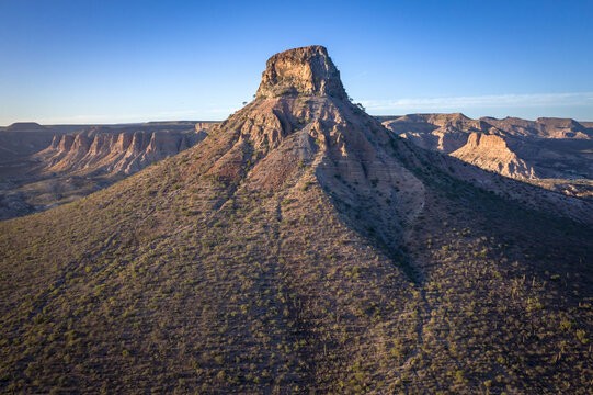 Aerial view of pilon hill with rugged terrain and clear sky, la purisima, baja california sur, mexico.