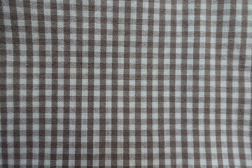 Simple cotton fabric with grey and white gingham pattern texture