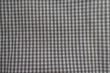 Texture of cotton fabric with grey and white gingham pattern