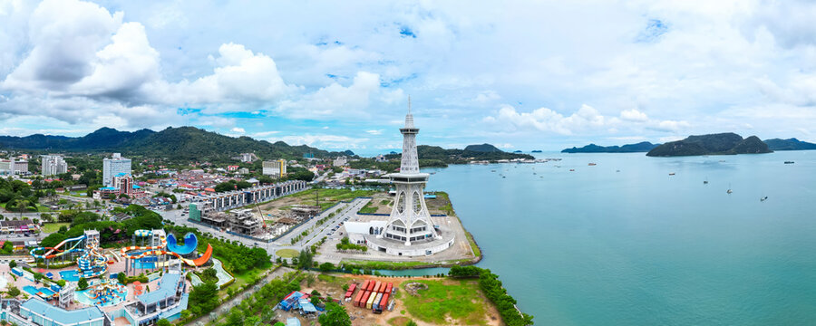 Aerial view of maha tower amidst a beautiful cityscape and ocean, Kuah, Malaysia.