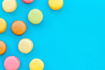 sweet dessert pattern with macarons on blue background flat lay mockup