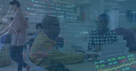Image of financial data processing over diverse business people using laptop