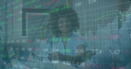 Image of financial data processing over diverse business people in office