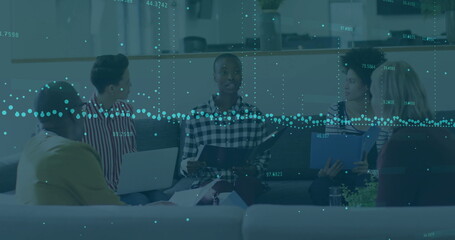 Image of financial data processing over diverse business people using laptop