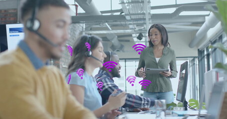 Image of wifi icons and data processing over diverse business people in office