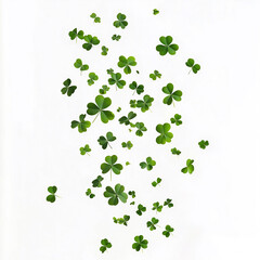 Fototapeta premium A swirl of four leaf clovers dancing gracefully in the air against a bright white background