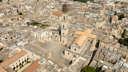 Aerial view of the cathedral of Lecce, in Apulia, Italy. The metropolitan cathedral of Santa Maria Assunta with its tall bell tower is located in Piazza del Duomo, in the historic center of the city.