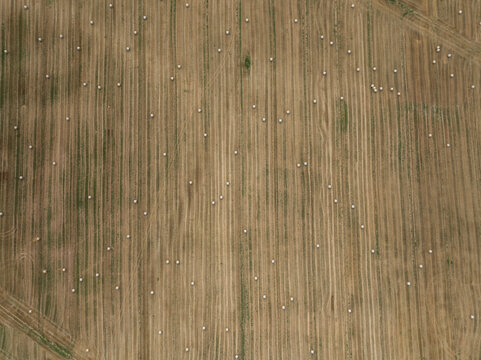 Aerial view of beautiful countryside with haystack field, Varennes-Saint-Sauveur, France.